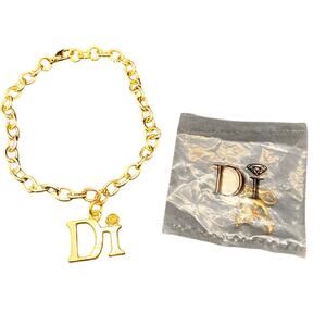 DIAMONDS INTERNATIONAL "Di" GOLD‎ TONE LINK CHARM BRACELET AND Dolphin CHARM